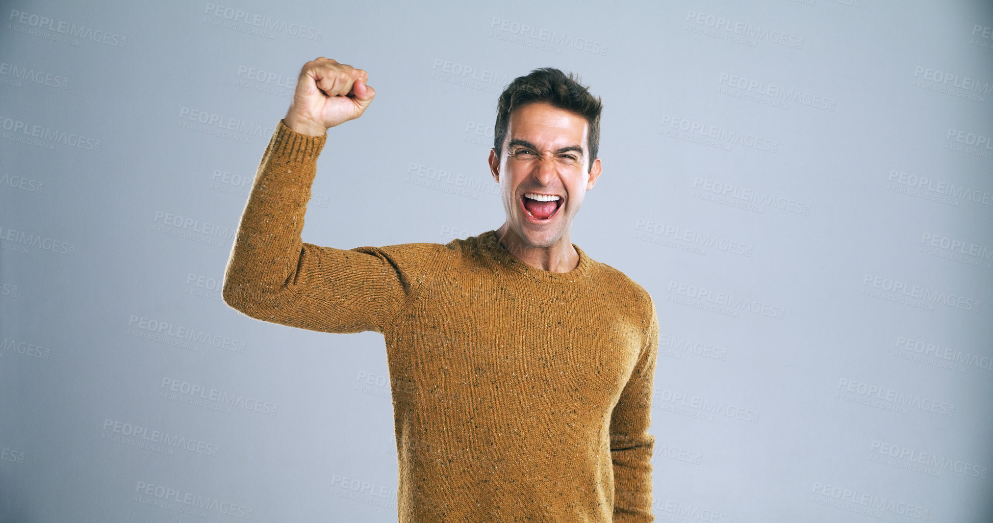 Buy stock photo Man, fist and portrait for winning in studio with shout, success and goals for bonus by background. Person, happy and celebration for profit, prize and giveaway with lottery, contest or competition