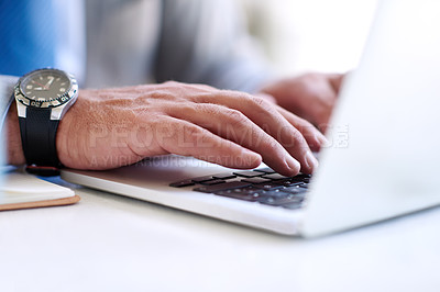 Buy stock photo Closeup shot of an unrecognizable businessman using a laptop outdoors