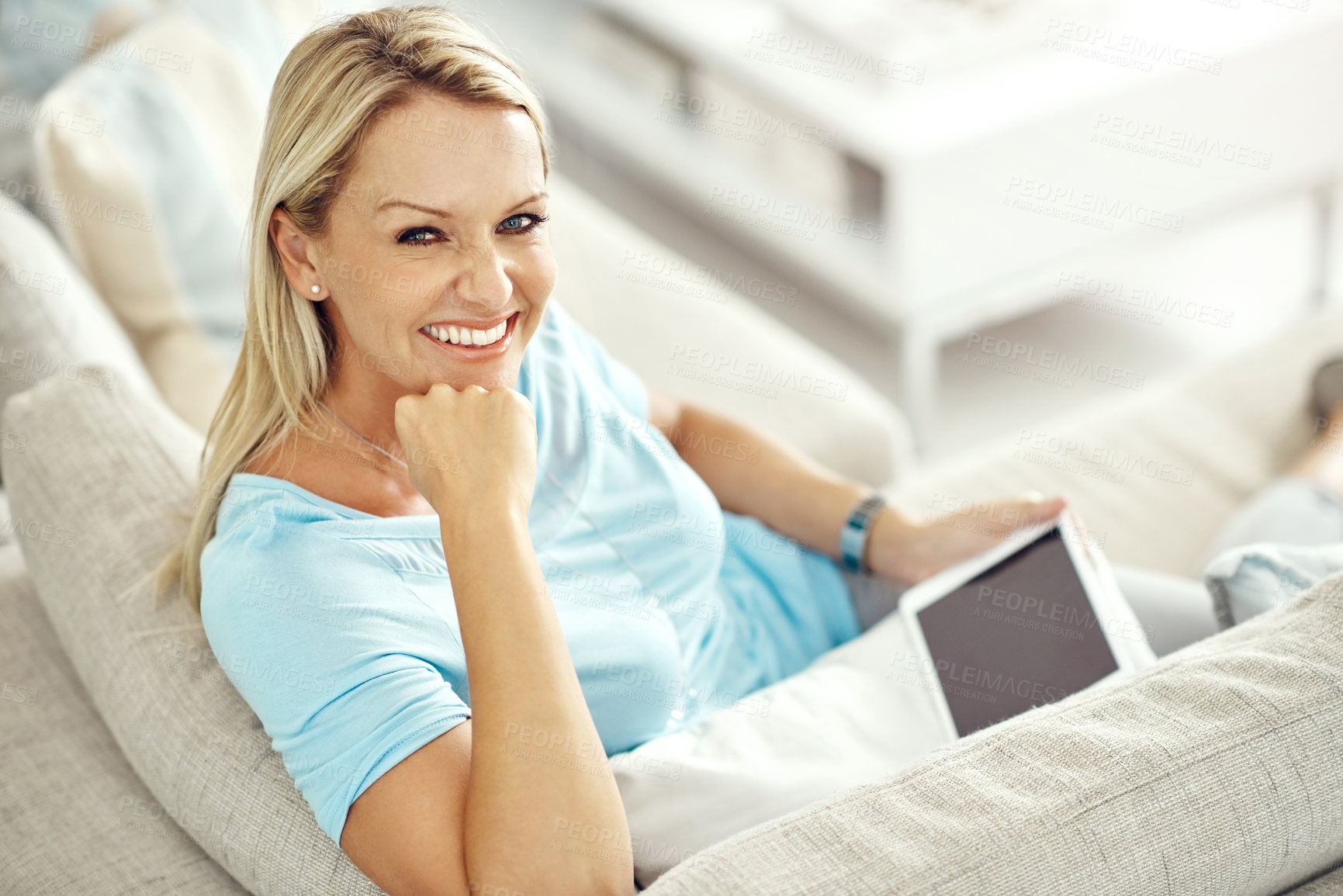 Buy stock photo Woman, tablet and relax in portrait on sofa in home with mock up space on screen with app, streaming or ebook. Mature person, digital touchscreen and smile for movie, film or subscription in lounge