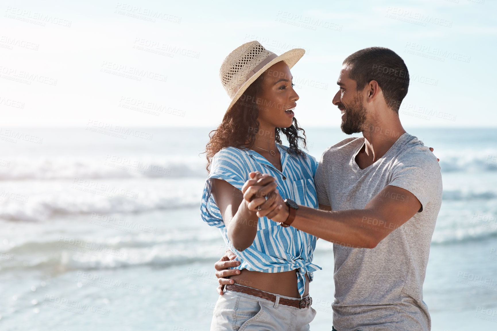 Buy stock photo Happy, couple and dance with waves at beach for outdoor travel, adventure and honeymoon holiday. Man, woman and celebration with smile by ocean for love, marriage connection and vacation in Cancun