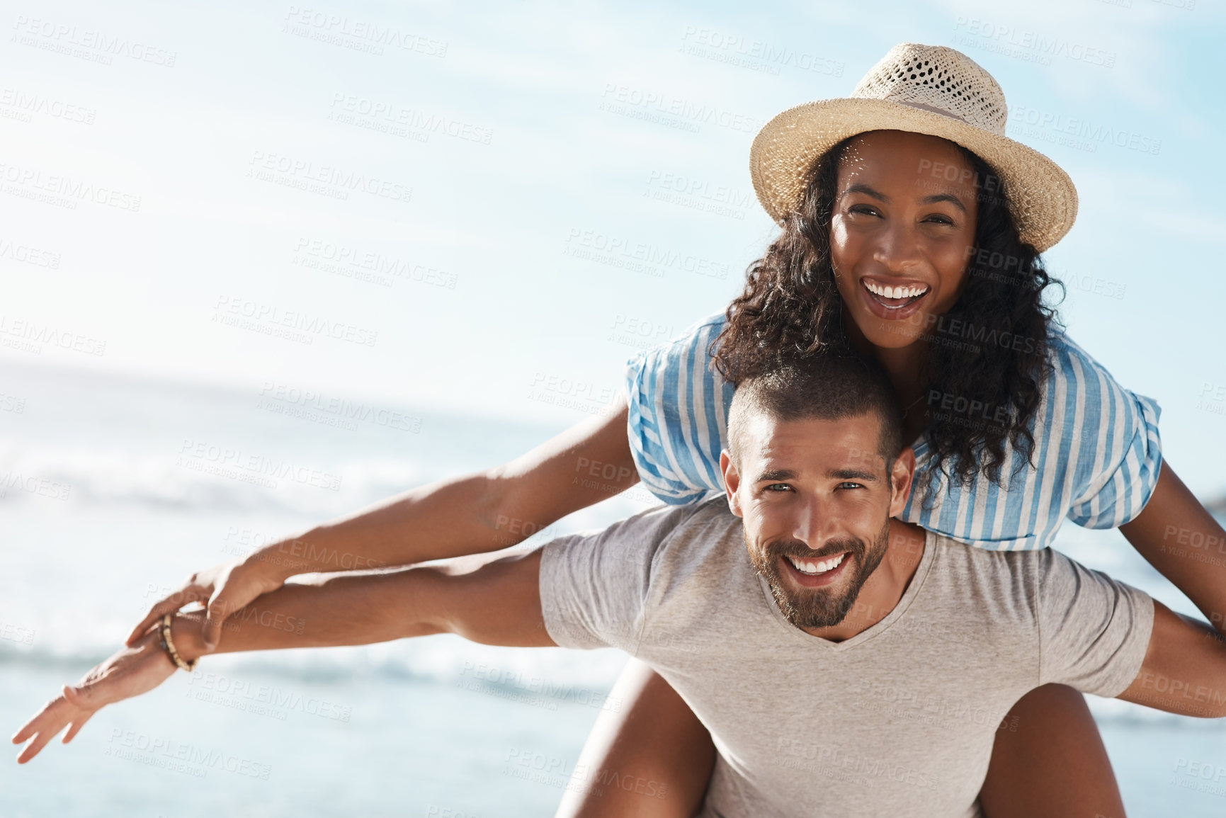 Buy stock photo Couple, portrait and piggyback at beach for travel, summer and tropical holiday together in San Diego. Man, woman and carrying on sand by ocean for adventure, love and relax on vacation with partner