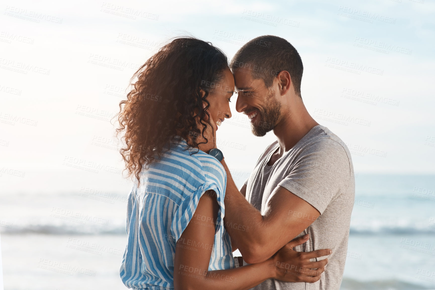 Buy stock photo Smile, couple and forehead touch on beach for marriage romance, loyalty together and bonding with love. Happy, man and woman with relationship support, vacation anniversary and ocean for date outdoor