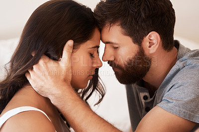 Buy stock photo Forehead, home bedroom and couple bonding, support and spending relax morning together in Argentina. Eyes closed, marriage love and romantic people with affection, care and enjoy quality time on bed
