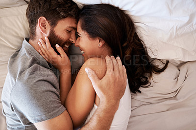 Buy stock photo Morning, bedroom hug and happy couple laugh at funny joke, relationship humor or comedy on honeymoon vacation. Affection, marriage and top view of relax man, woman or bonding people laughing in bed
