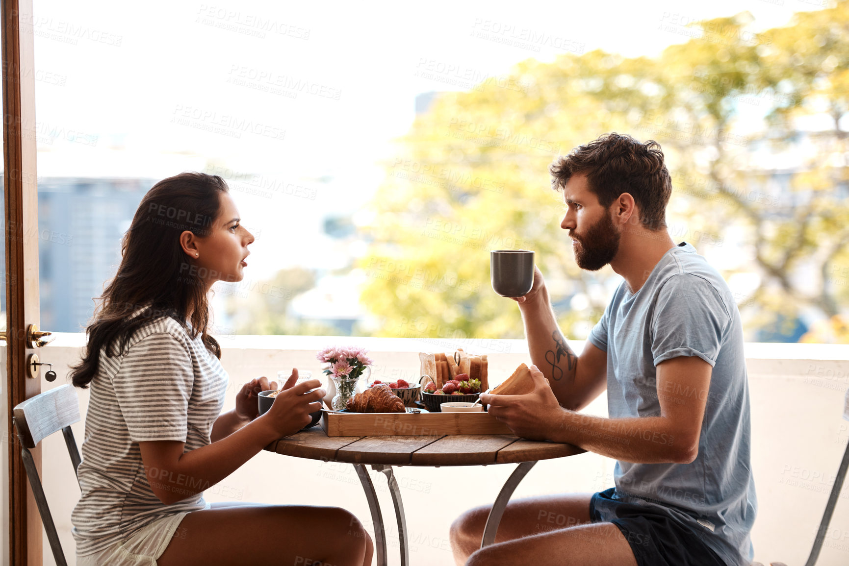 Buy stock photo Breakfast food, home and couple argue, fight or angry over relationship problem, mistake or frustrated on apartment balcony. Divorce risk, marriage fail and people in morning conflict during brunch