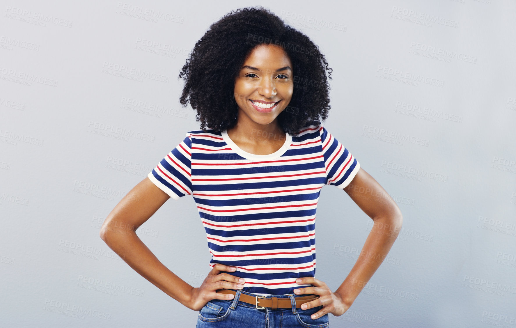 Buy stock photo Studio shot of a confident young woman posing against a grey background