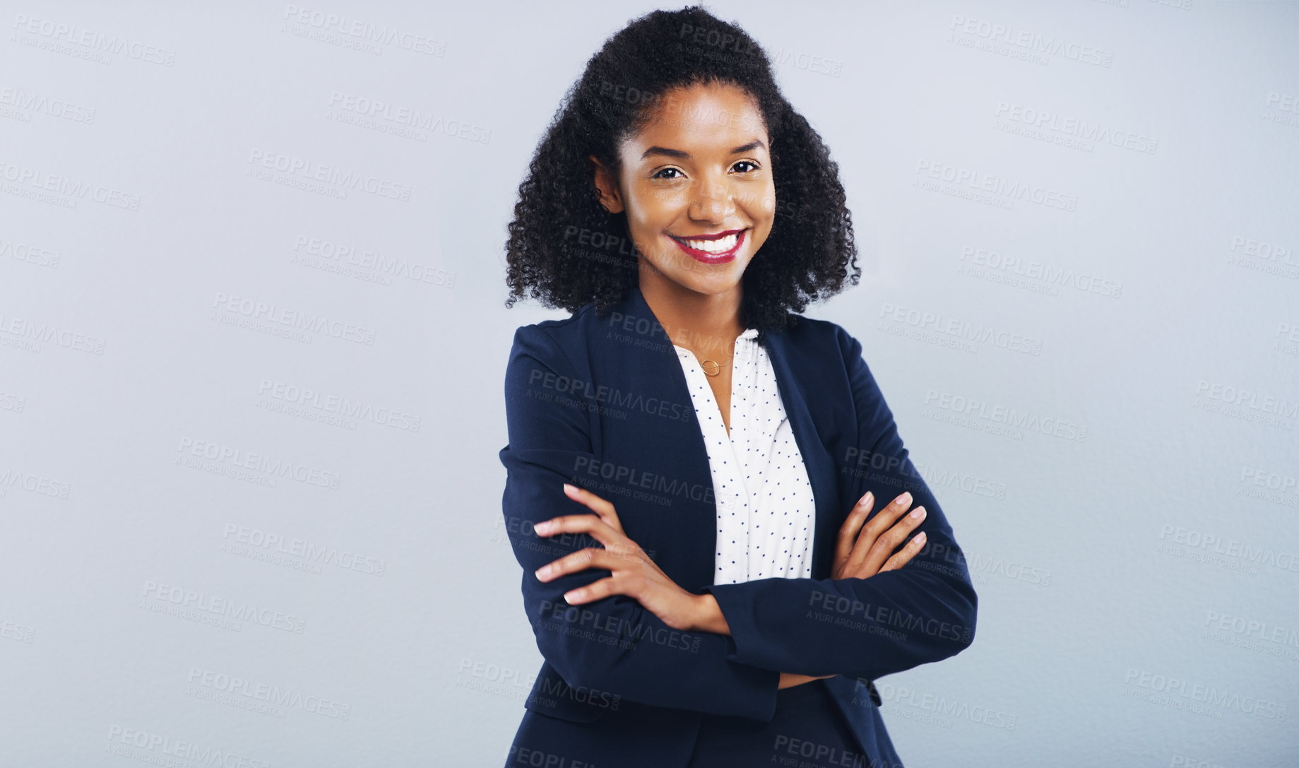 Buy stock photo Studio shot of a confident young businesswoman posing against a grey background