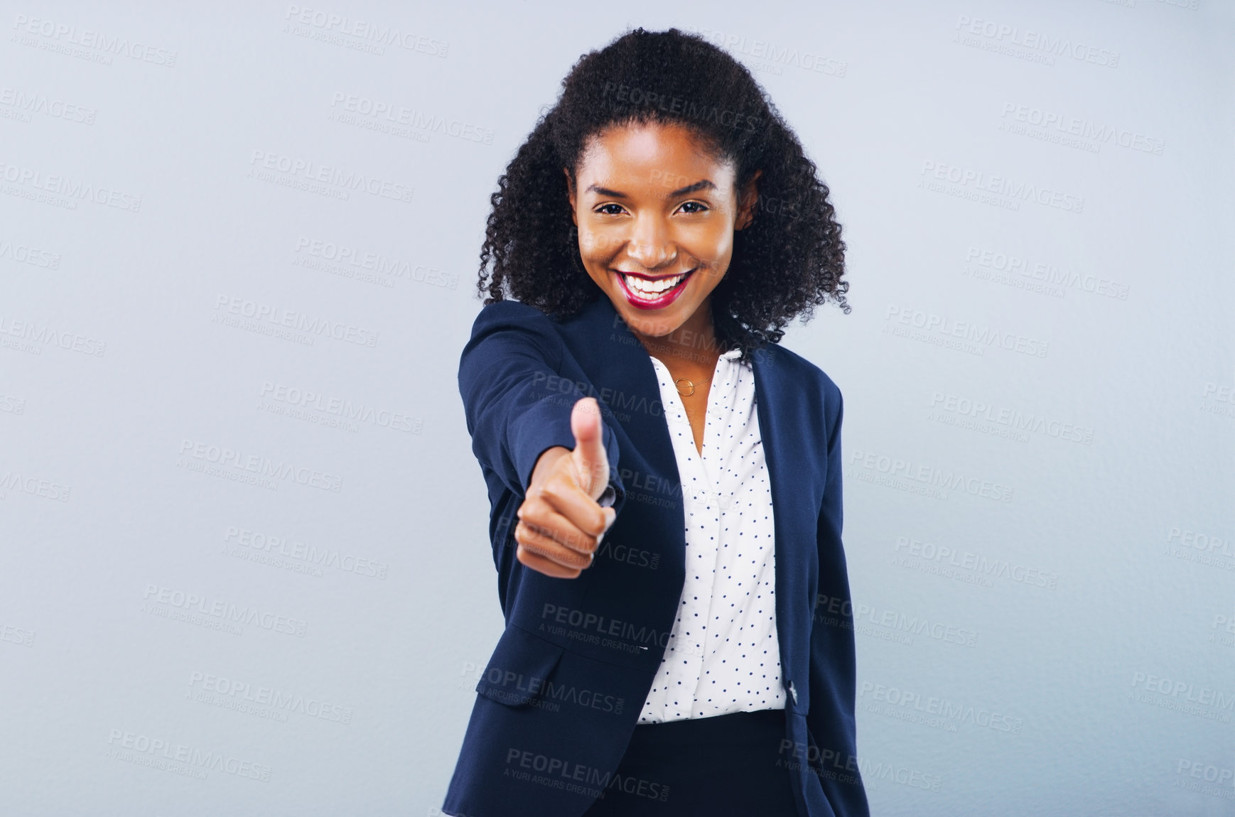 Buy stock photo Studio shot of an attractive young businesswoman giving thumbs up against a grey background