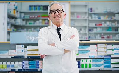 Buy stock photo Cropped shot of a male pharmacist working in a chemist
