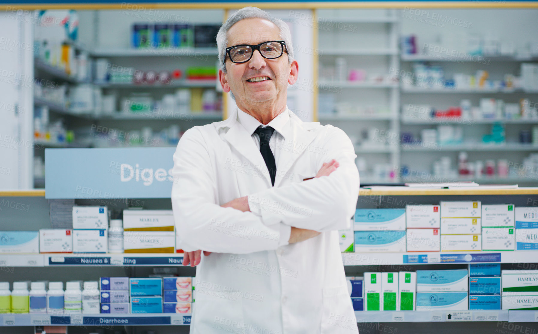 Buy stock photo Cropped shot of a male pharmacist working in a chemist