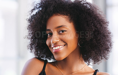 Buy stock photo Portrait of a happy young woman smiling confidently