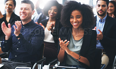 Buy stock photo Shot of a group of businesspeople clapping while attending a conference