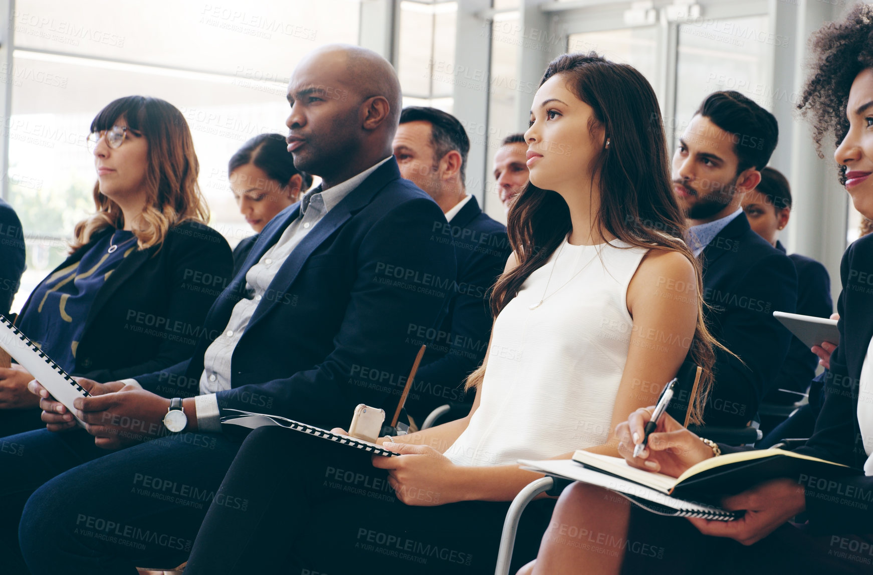 Buy stock photo Business people, conference and audience in workshop training taking notes for team marketing or sales. Employee workers listening to coaching, presentation or meeting seminar for business strategy