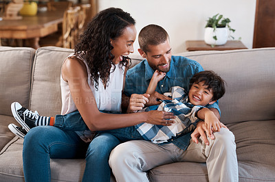 Buy stock photo Family, laughing and tickle in home portrait, funny games and goofy bonding for love connection. Parents, son and kid for happiness in living room on weekend, mother and father for fun in Brazil