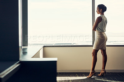 Buy stock photo Full length shot of an attractive young businesswoman posing with her arms folded while standing in her office