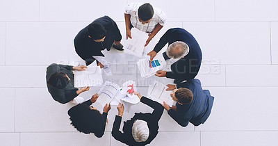 Buy stock photo Top view, documents and business people planning a strategy in a meeting for financial increase in sales revenue. Teamwork, chart and corporate employees with paperwork for data analysis or analytics