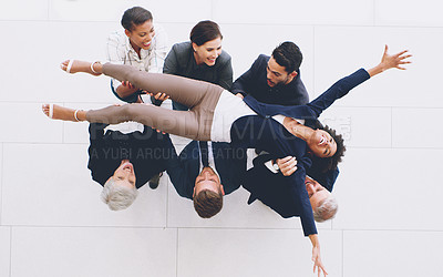 Buy stock photo Top view, business group and carrying woman with joy for successful deal and celebration in the office. Celebrate, success and businesspeople lifting a female staff member for cheering 
