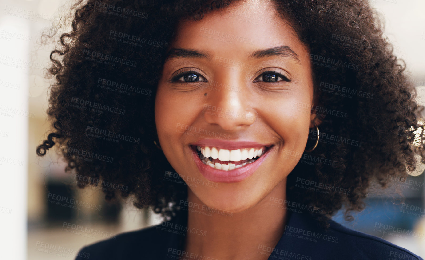 Buy stock photo Cropped portrait of an attractive young businesswoman smiling and standing in the office during the day