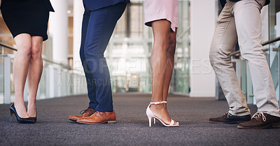 Buy stock photo Cropped shot of a diverse group of unrecognizable businesspeople standing in the office during the day