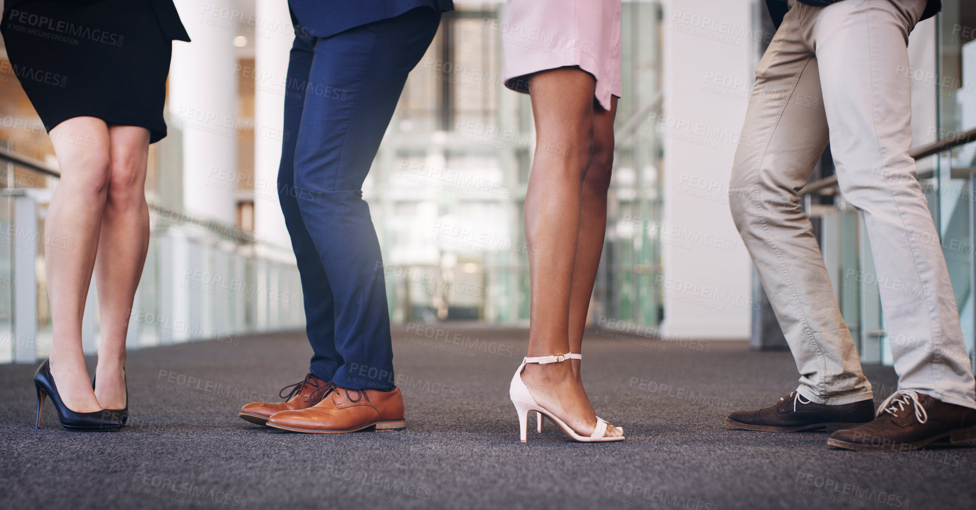 Buy stock photo Cropped shot of a diverse group of unrecognizable businesspeople standing in the office during the day