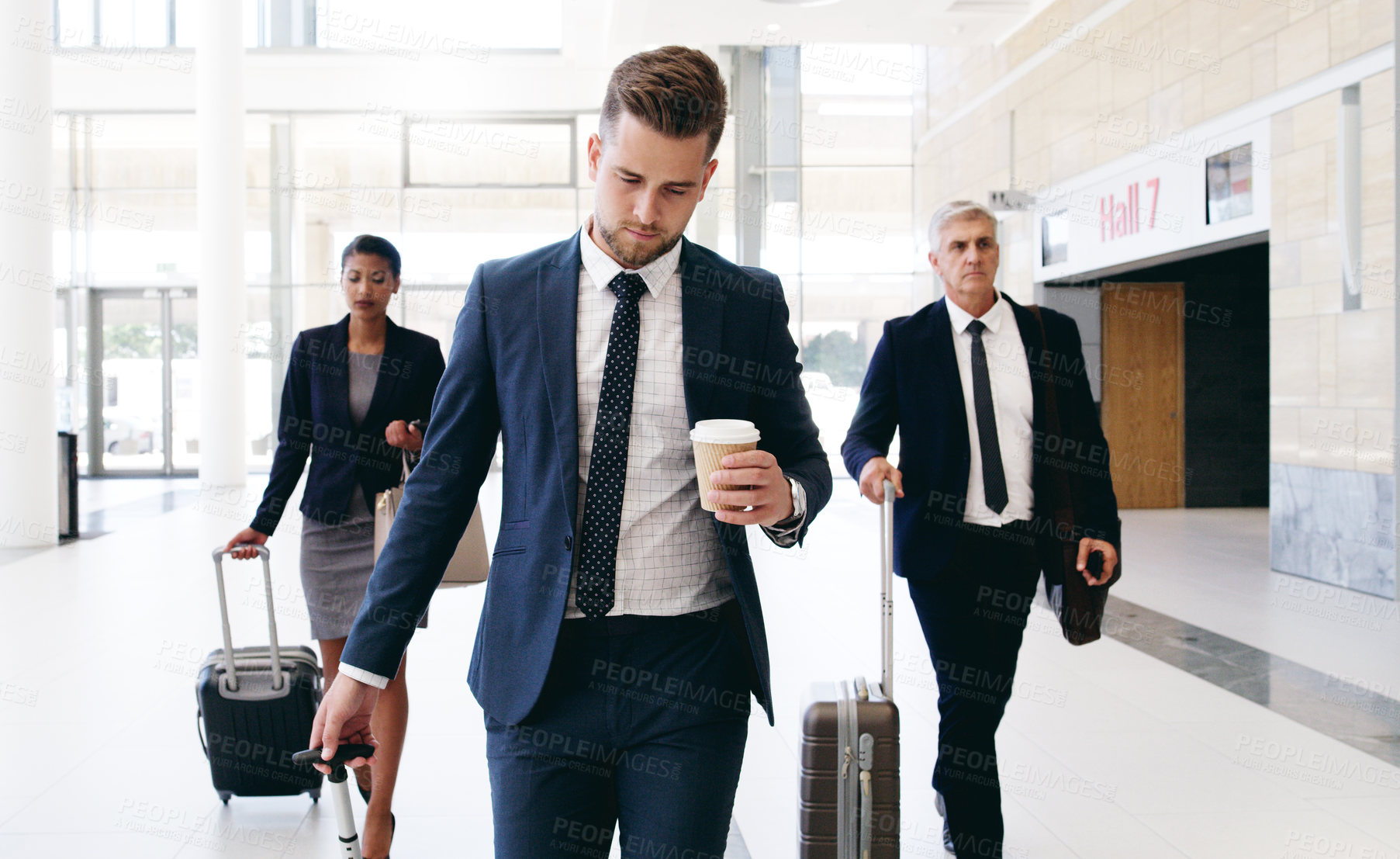 Buy stock photo Travel, international meeting and business people walking in hotel, airport and reception area with suitcase. Teamwork, collaboration and group of managers travelling for global business meeting