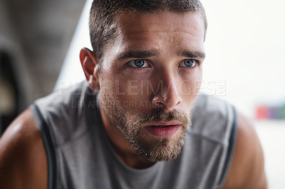 Buy stock photo Shot of handsome young sportsman taking a break while exercising outdoors