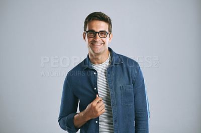 Buy stock photo Confidence, fashion and portrait of man in studio with denim for casual style, clothes and cool outfit. Positive attitude, joy and isolated person with smile, pride and happy on white background