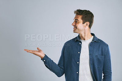 Buy stock photo Cropped shot of a handsome man advertising copyspace