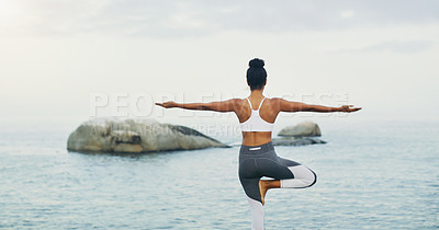 Buy stock photo Beach, yoga or woman with balance or body flexibility for peace or mindfulness in outdoor nature to relax. Chakra, calm or back view of girl on rock at sea or ocean for awareness or soul in pilates