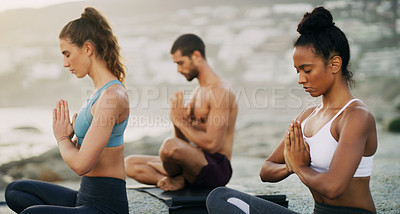 Buy stock photo Man, women and meditation on beach for zen peace in morning mist, mindfulness or healing. Friends, hands and wellness chakra for self care or holistic yogi as group for balance, calm or environment
