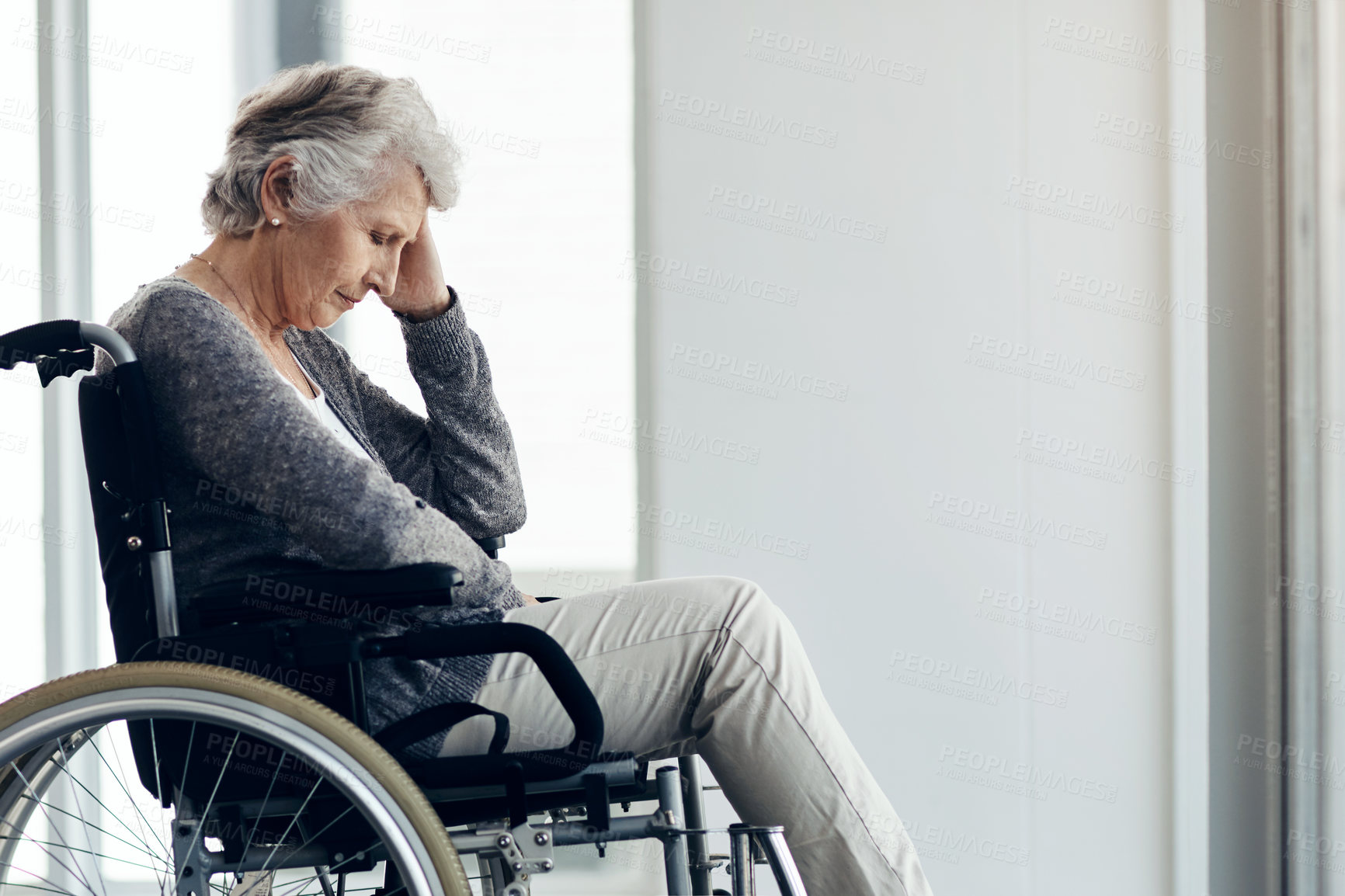 Buy stock photo Cropped shot of a senior woman sitting in a wheelchair