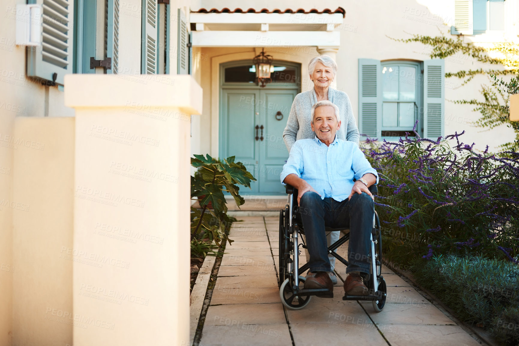 Buy stock photo Full length shot of a cheerful wheelchair bound senior man relaxing with his wife in their backyard at home