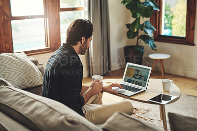 Buy stock photo Remote work, man and laptop in home with coffee, blog and company review on internet. Male person, small business and technology in living room for contact, ecommerce and interior design on sofa