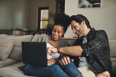 Buy stock photo Laptop, interracial and entertainment with a couple watching a video using an online subscription service to relax. Computer, streaming or internet with a man and woman bonding together over a movie