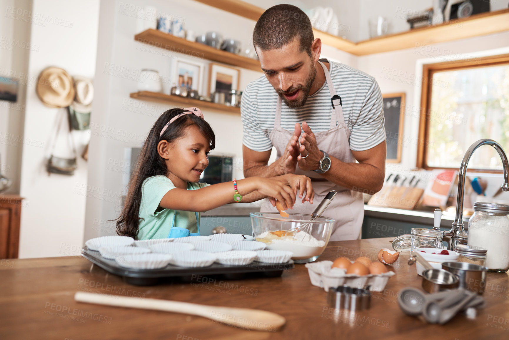 Buy stock photo Father, child and teaching with cooking, eggs and nutrition as parents in home for education. Male person, girl and learning for youth development, support and bonding on kitchen counter as family