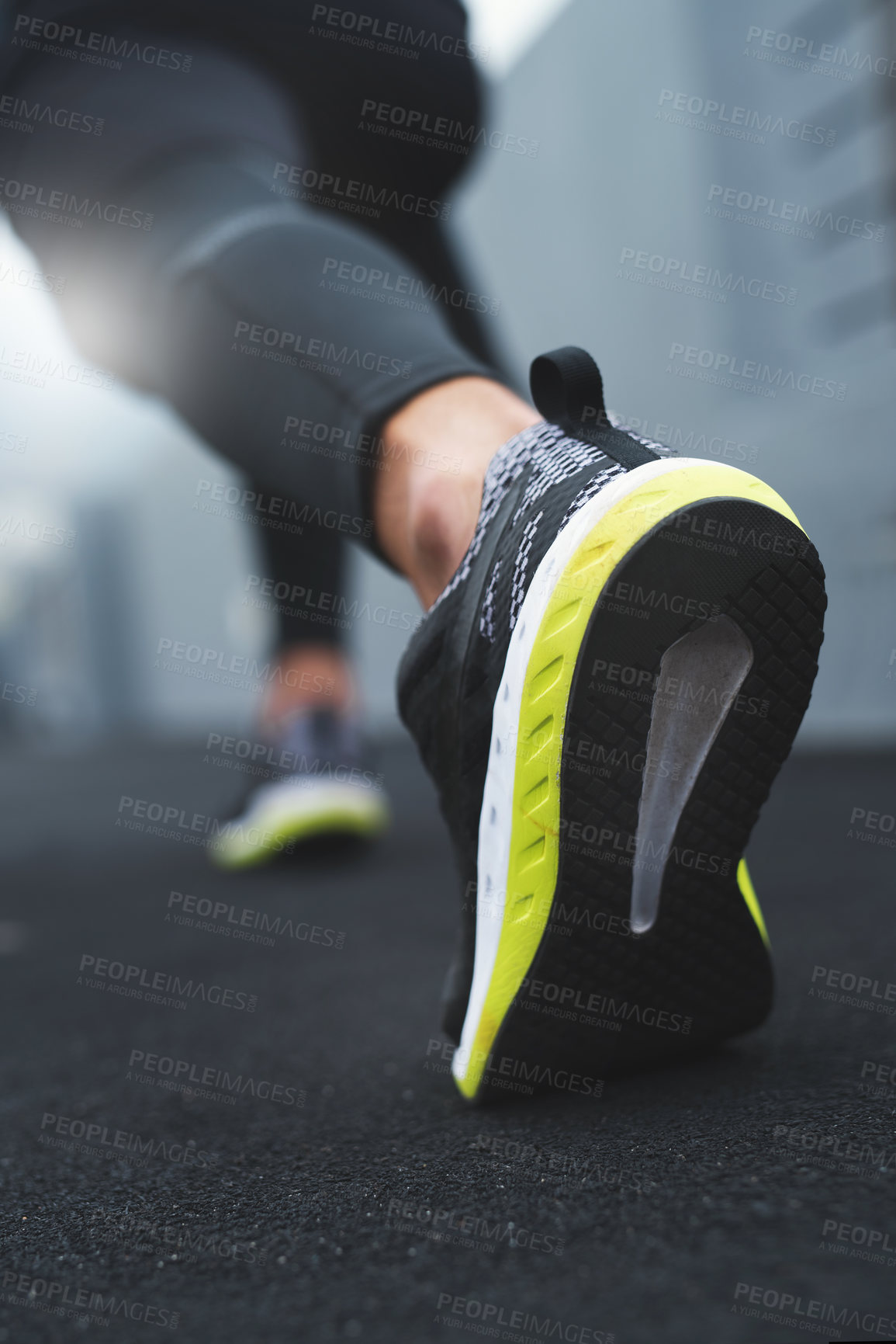 Buy stock photo Closeup shot of a sporty man in starting position while exercising outdoors