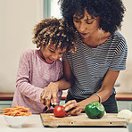 Cutting vegetables with mom's help