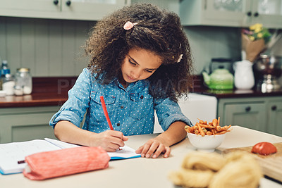 Buy stock photo Cropped shot of a young girl doing her homework at home