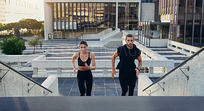 Buy stock photo Healthy, couple or athletes in city running on stairs for exercise, workout or training for marathon. Sports, man and woman jogging in urban area active for wellness, cardio and endurance or strength