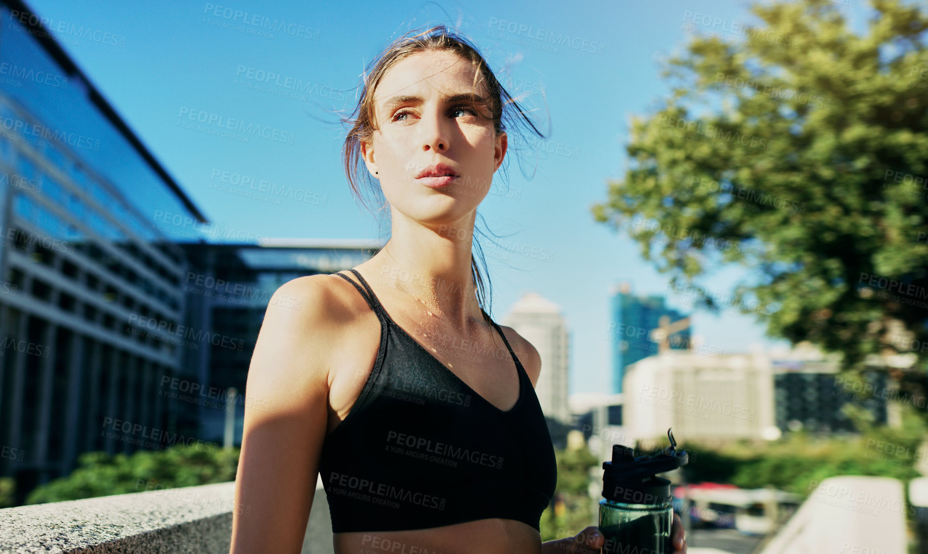 Buy stock photo Woman, thinking and water outdoors in city for rest, fitness and wellness in sportswear by buildings. Break, runner and workout in urban town for breathing, goals and challenge for cardio in new york