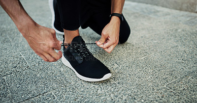 Buy stock photo Person, runner or hands tie shoes to start workout, sports exercise or fitness training for running. Closeup, footwear or healthy athlete on sidewalk in urban town or city ready for sprinting or jog