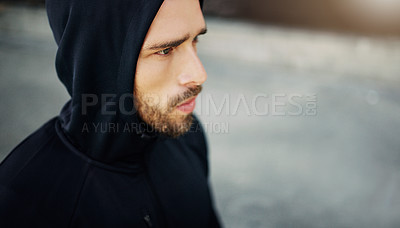 Buy stock photo Man, thinking and hoodie in city for workout, exercise and training on sidewalk for wellness. Runner, mockup and determined in urban area for fitness, health and fatigue from physical activity