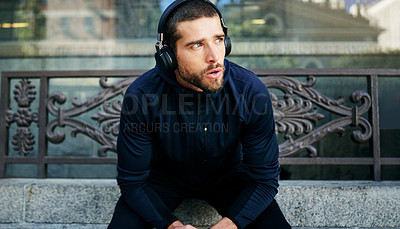 Buy stock photo City, headphones and tired fitness man breathing outdoor for training, workout or running for morning cardio. Sports, fatigue or runner streaming music, radio or podcast for exercise motivation