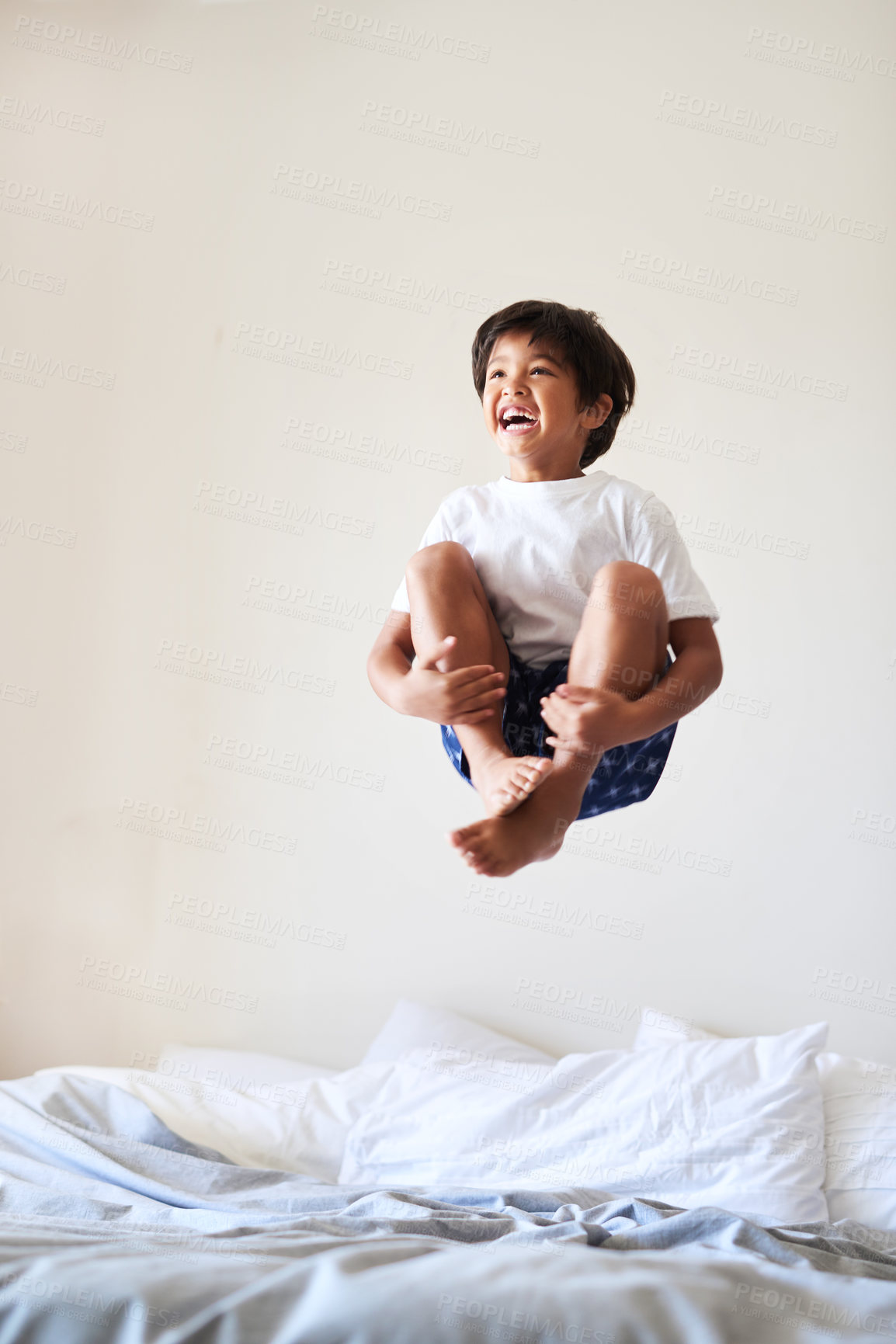 Buy stock photo Bed, jumping and boy with happiness, smile and excited with energy, activity and carefree. House, weekend break and kid with game, freedom and playing with fun, cheerful and wow with childhood or joy