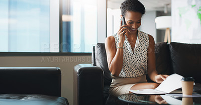 Buy stock photo Shot of a businesswoman talking on her cellphone while sitting in a modern office