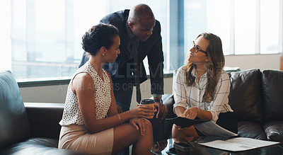 Buy stock photo Shot of a group of colleagues having a discussion at the office