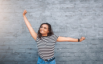 Buy stock photo Woman, wall and stretch with smile or excited for fashion, streetwear or trendy and cool. Female person, bricks or hands with happiness for summer with style, celebration or winner in New York or USA