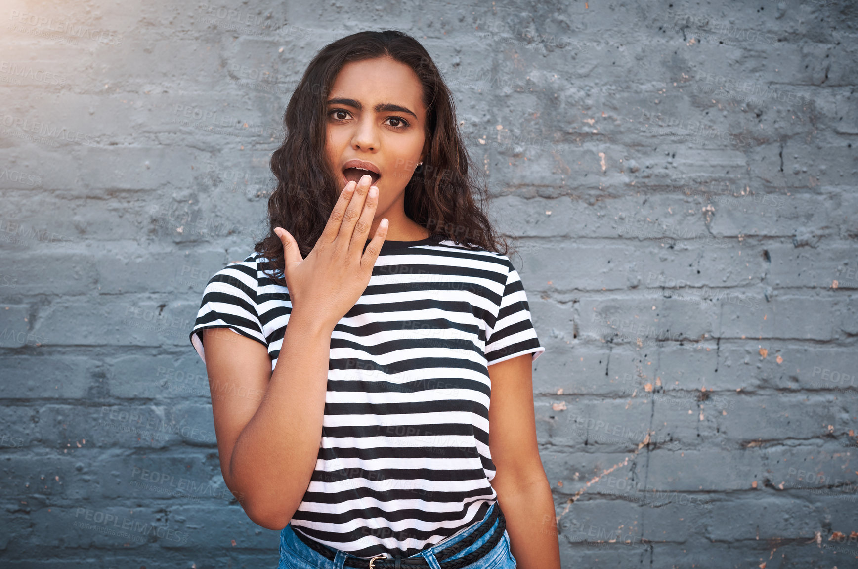 Buy stock photo Brick, wall and shock of girl, hand and news of sale, discount or deal for clothes, store and shop. Outdoor, weekend and surprise for gossip, secret and cover of mouth, announcement and notification