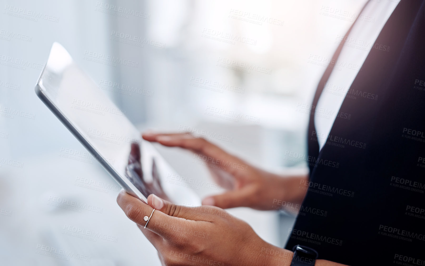 Buy stock photo Closeup shot of an unrecognisable businesswoman using a digital tablet in an office