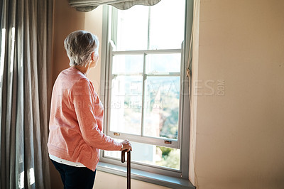 Buy stock photo Senior woman, nursing home and window for thinking, vision or ideas with walking stick, disability or rehabilitation. Elderly lady, remember or looking ahead in retirement, house or memory in morning
